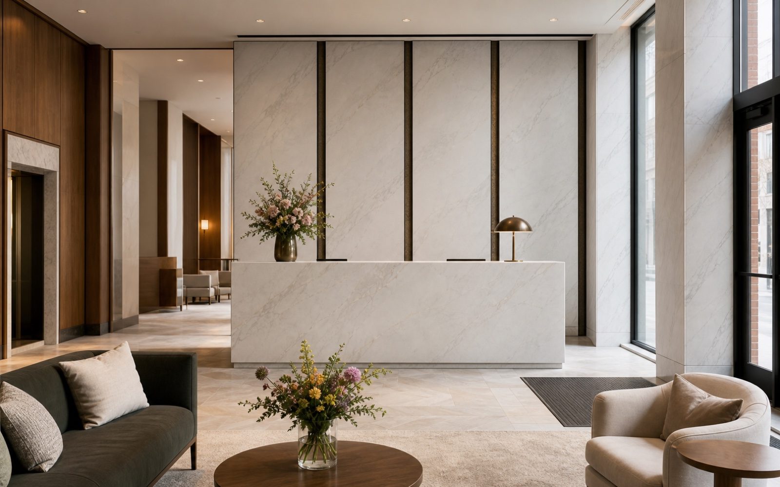 Boutique hotel lobby with marble reception desk and wall panels